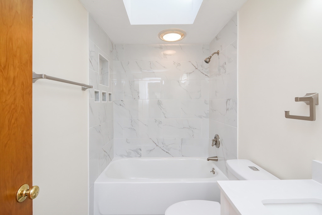 25 Indian Run Road Bellingham, MA 02019 - Photo 17 of 29 a bathroom with a bathtub and shower