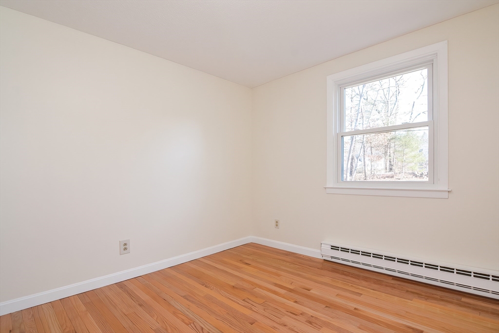 25 Indian Run Road Bellingham, MA 02019 - Photo 19 of 29 an empty room with a window