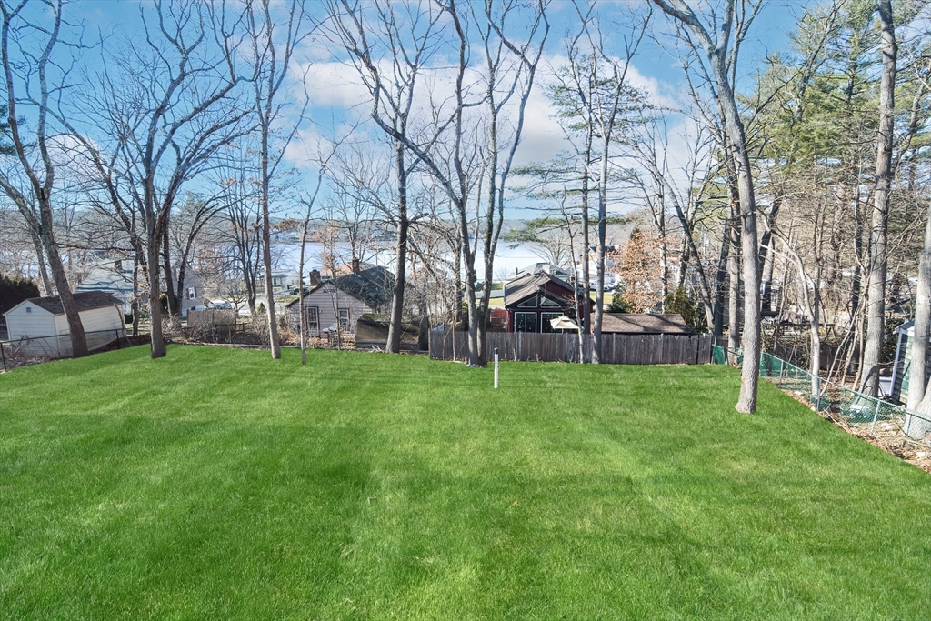 25 Indian Run Road Bellingham, MA 02019 - Photo 4 of 29 a view of a yard with a house