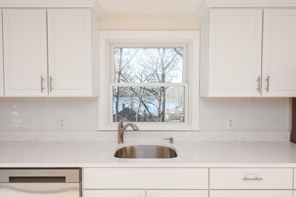 25 Indian Run Road Bellingham, MA 02019 - Photo 6 of 29 a kitchen with a sink and cabinets