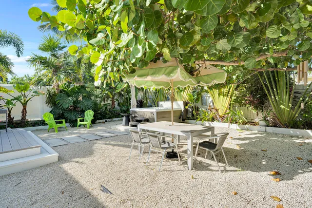 a view of a lounge chair with a tree