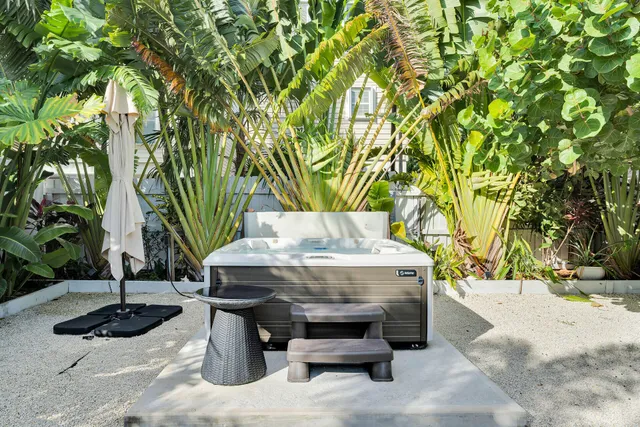 a view of a water fountain in the back yard
