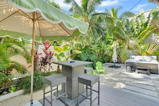 a backyard with a table and chairs