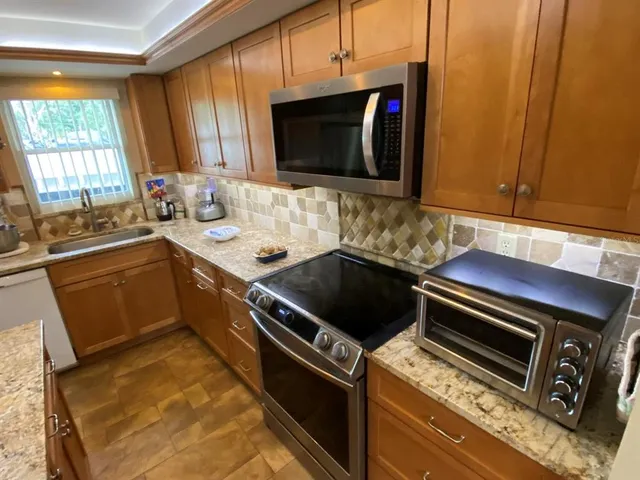 a kitchen with a stove and a microwave