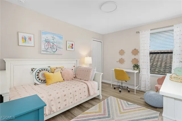 a bathroom with a granite countertop sink a mirror a vanity and shower