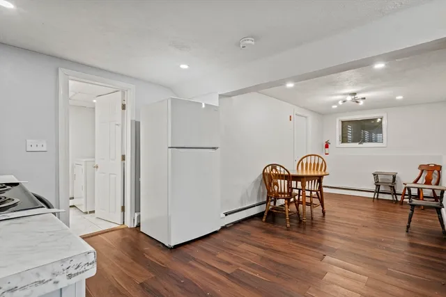 a kitchen with a stove a sink and a refrigerator