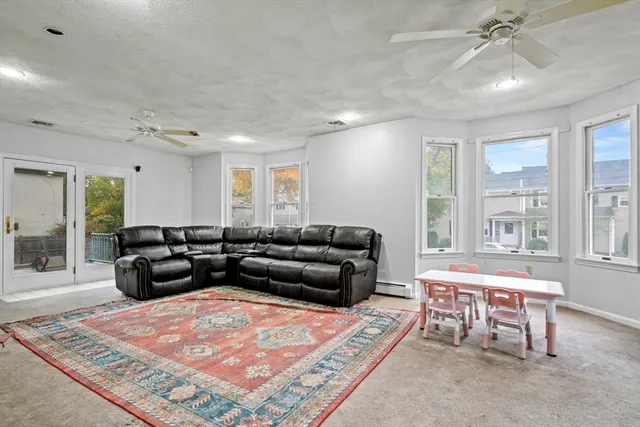 a living room with furniture and a rug