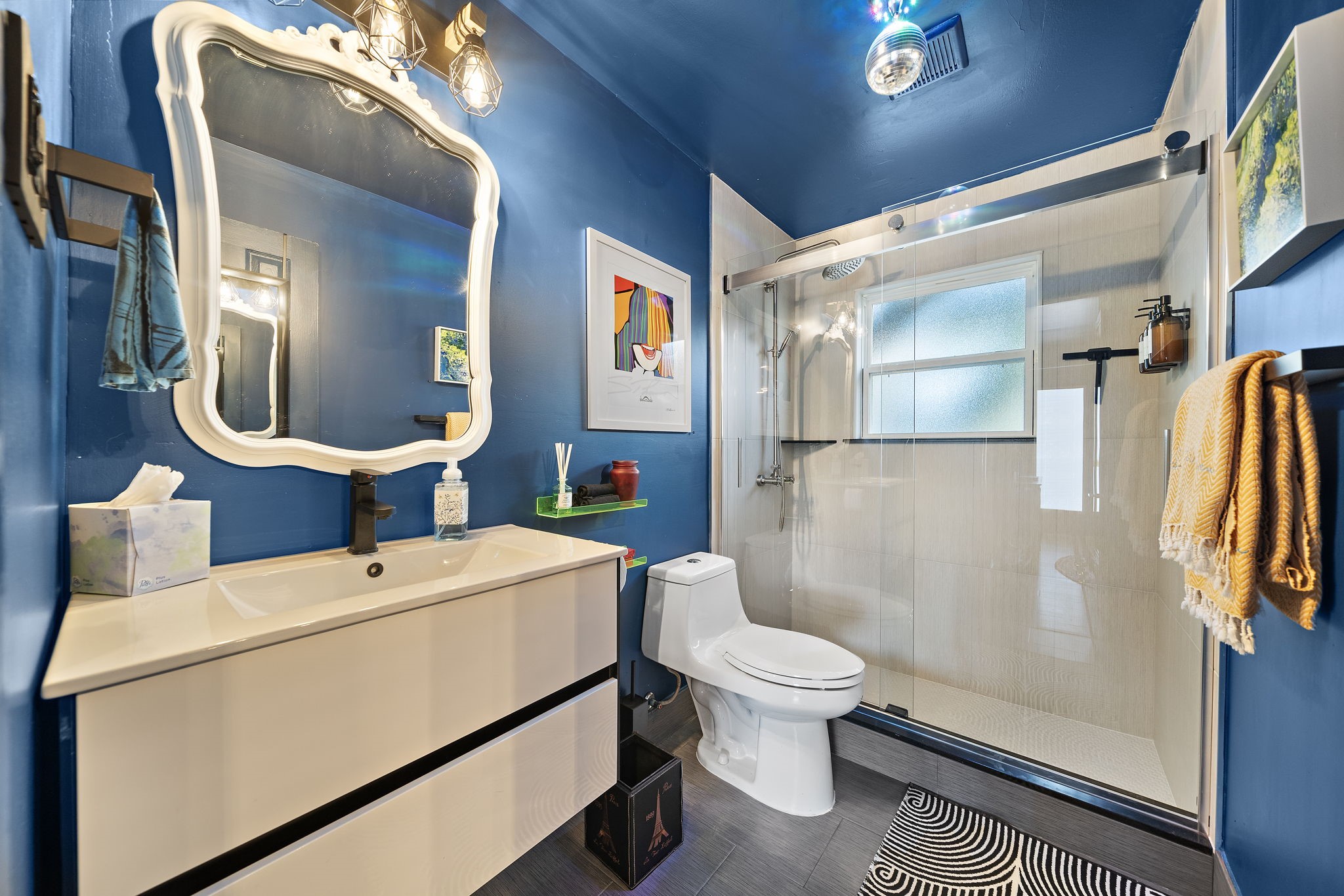 1306 Taft Street, Unit 2 Houston, TX 77019 - Photo 2 of 6 a bathroom with a toilet a sink and a mirror