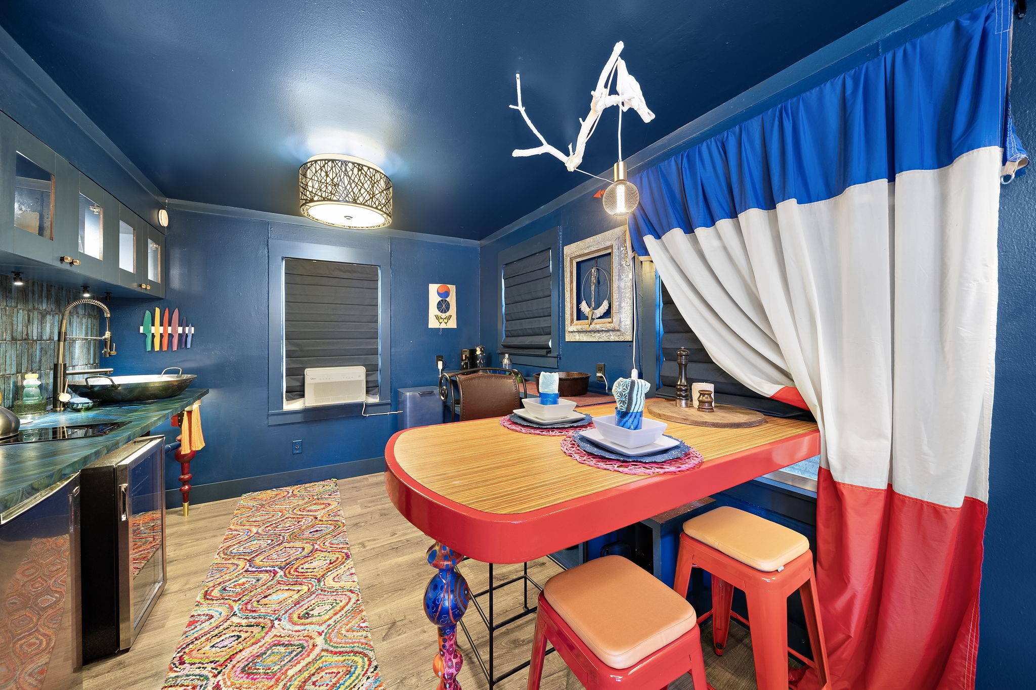 1306 Taft Street, Unit 2 Houston, TX 77019 - Photo 3 of 6 a view of a dining room with furniture and a chandelier