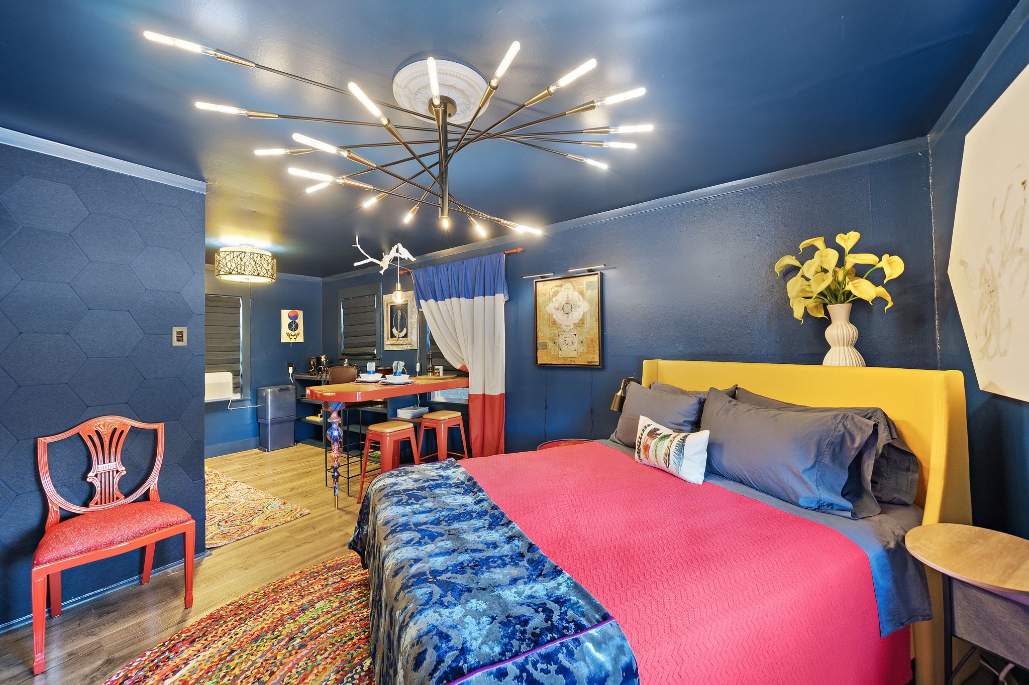 1306 Taft Street, Unit 2 Houston, TX 77019 - Photo 4 of 6 a living room with a table chairs and a chandelier