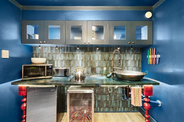 a kitchen with a stove and cabinets