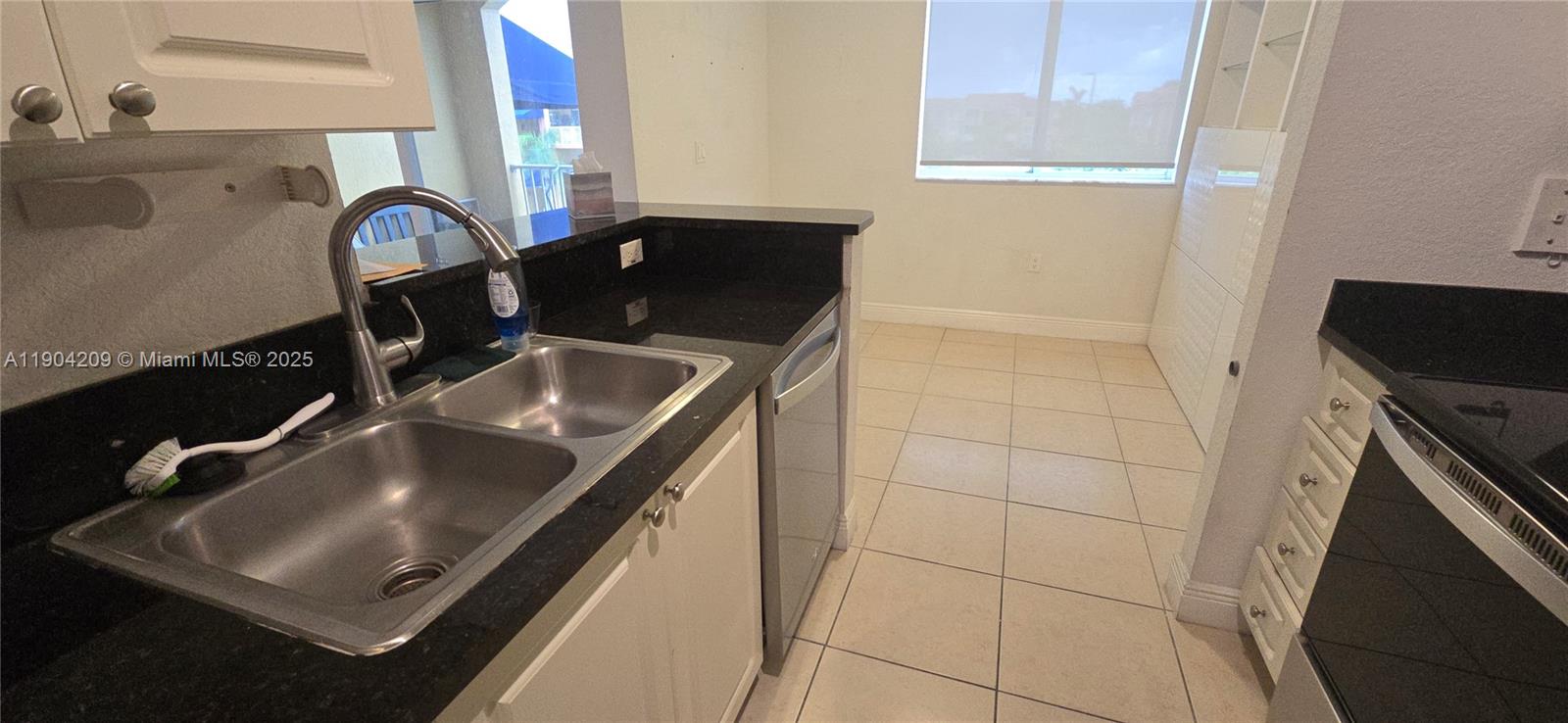 21000 Southwest 87th Avenue, Unit 308 Cutler Bay, FL 33189 - Photo 14 of 30 a close view of sink and tap