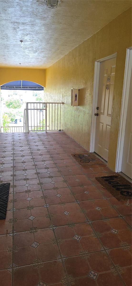 21000 Southwest 87th Avenue, Unit 308 Cutler Bay, FL 33189 - Photo 2 of 30 a view of empty room with wooden floor