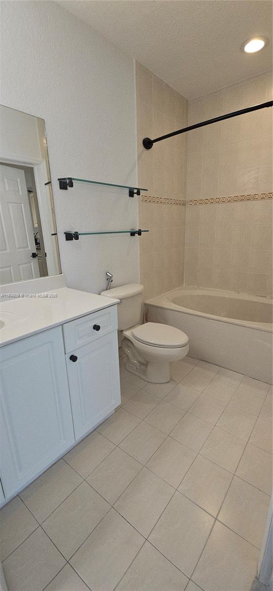 21000 Southwest 87th Avenue, Unit 308 Cutler Bay, FL 33189 - Photo 24 of 30 a bathroom with a toilet a sink and shower