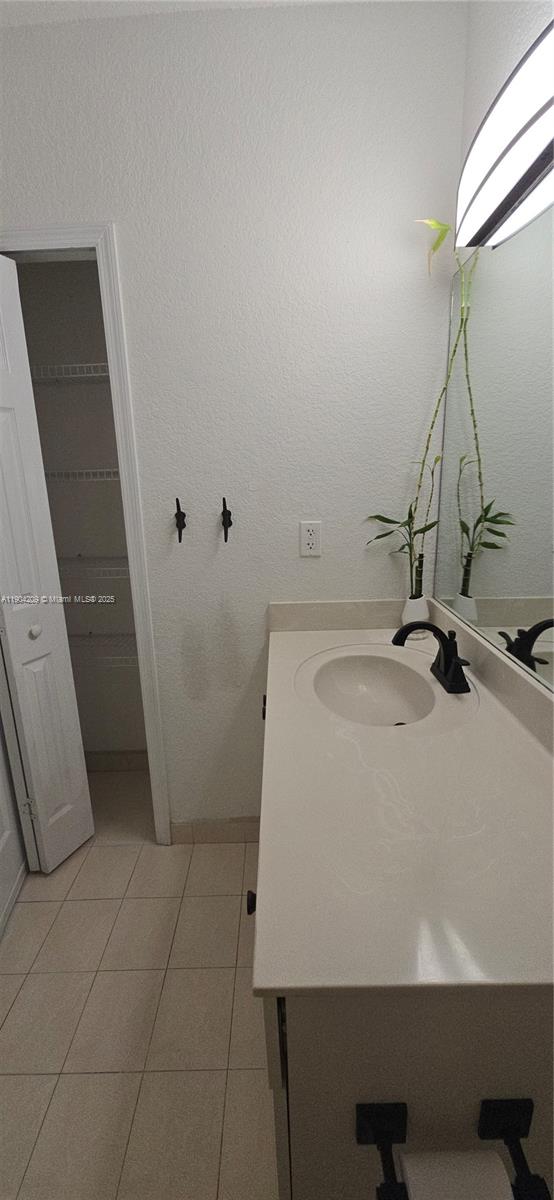 21000 Southwest 87th Avenue, Unit 308 Cutler Bay, FL 33189 - Photo 27 of 30 a bathroom with a sink a toilet and a bathtub