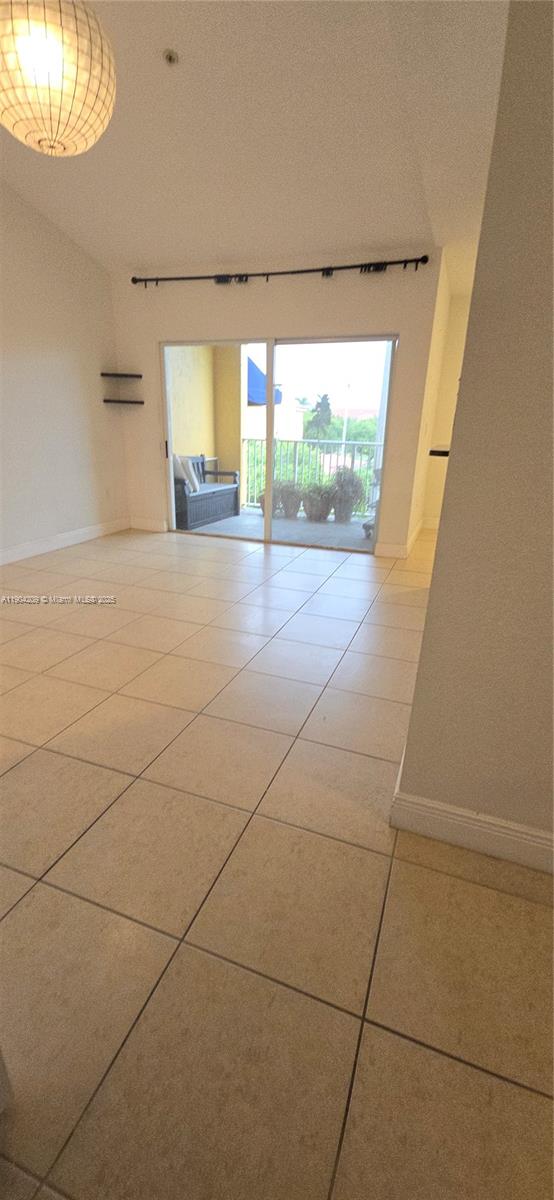 21000 Southwest 87th Avenue, Unit 308 Cutler Bay, FL 33189 - Photo 4 of 30 a view of a livingroom with wooden floor and a large window