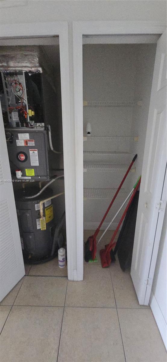 21000 Southwest 87th Avenue, Unit 308 Cutler Bay, FL 33189 - Photo 6 of 30 a room with water heater and storage and utility