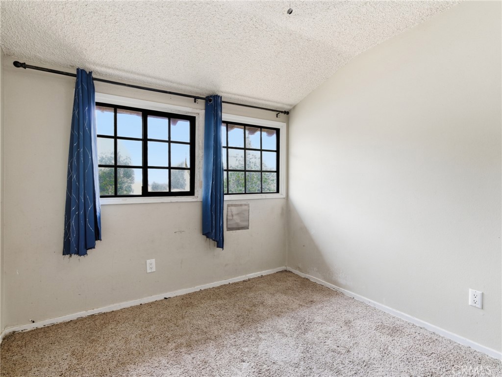 10127 Foothill Boulevard Sylmar, CA 91342 - Photo 14 of 33 an empty room with windows