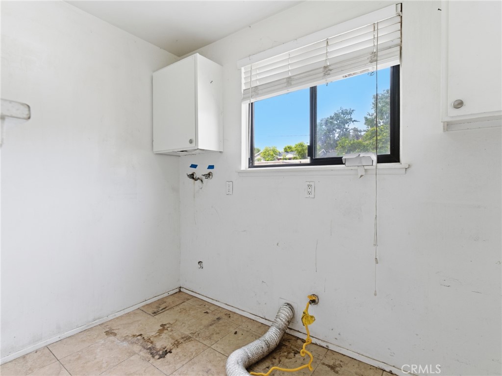 10127 Foothill Boulevard Sylmar, CA 91342 - Photo 18 of 33 a view of storage and utility room with wooden floor