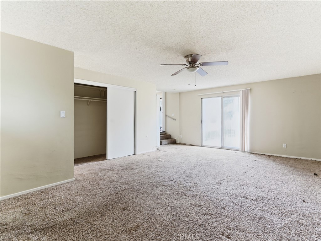 10127 Foothill Boulevard Sylmar, CA 91342 - Photo 19 of 33 a view of an empty room with a ceiling fan