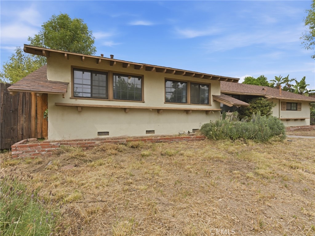 10127 Foothill Boulevard Sylmar, CA 91342 - Photo 2 of 33 a front view of a house with a yard