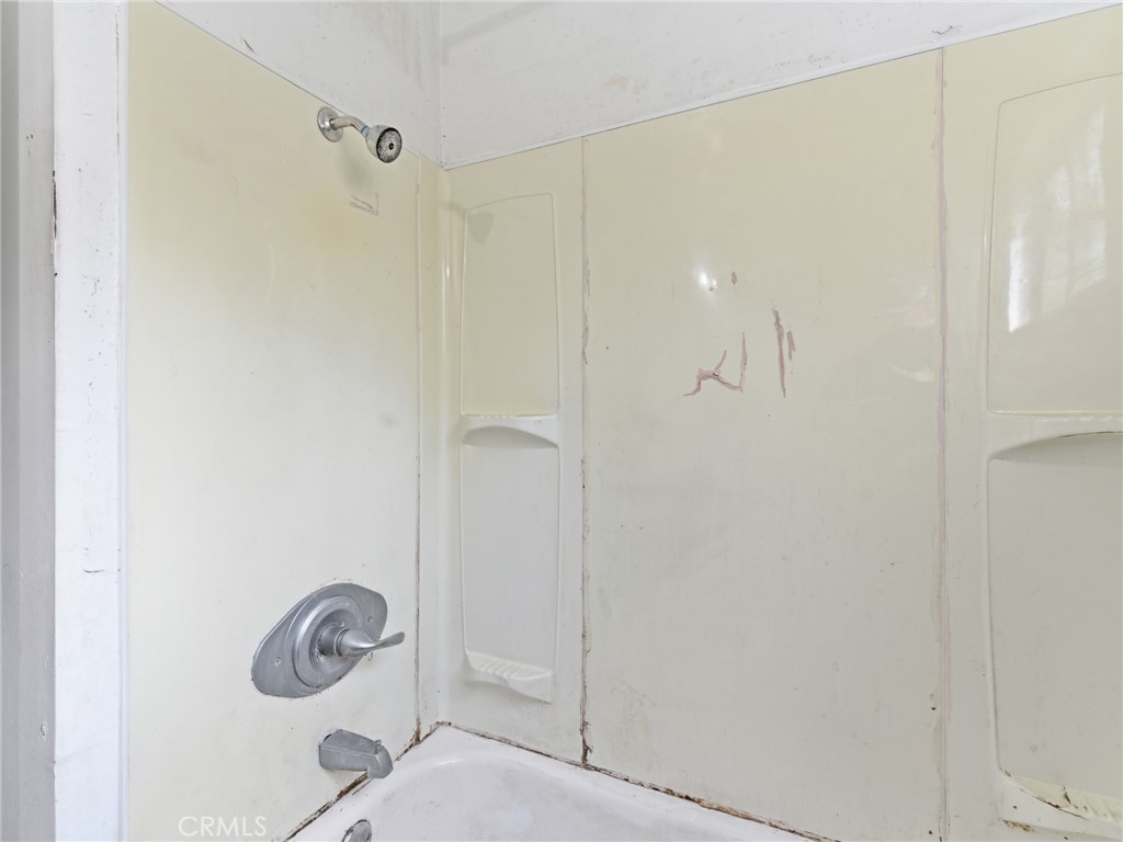 10127 Foothill Boulevard Sylmar, CA 91342 - Photo 23 of 33 a bathroom with a shower