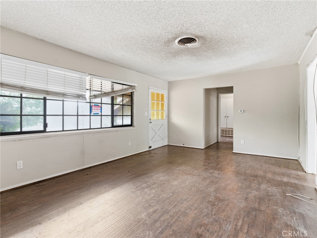 10127 Foothill Boulevard Sylmar, CA 91342 - Photo 26 of 33 an empty room with windows