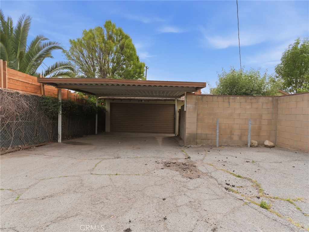 10127 Foothill Boulevard Sylmar, CA 91342 - Photo 29 of 33 a view of a house with a backyard