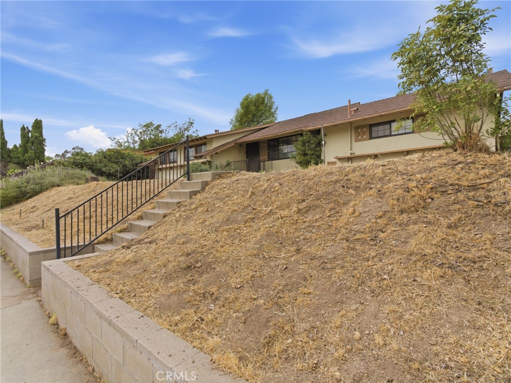 10127 Foothill Boulevard Sylmar, CA 91342 - Photo 33 of 33 a view of a house with a small yard