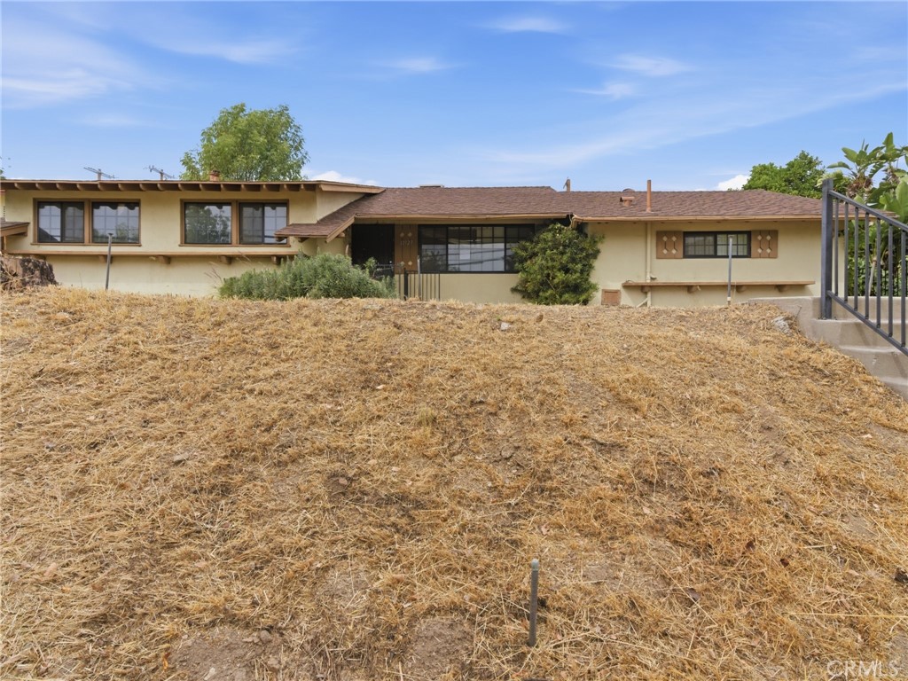 10127 Foothill Boulevard Sylmar, CA 91342 - Photo 4 of 33 front view of a house with a yard