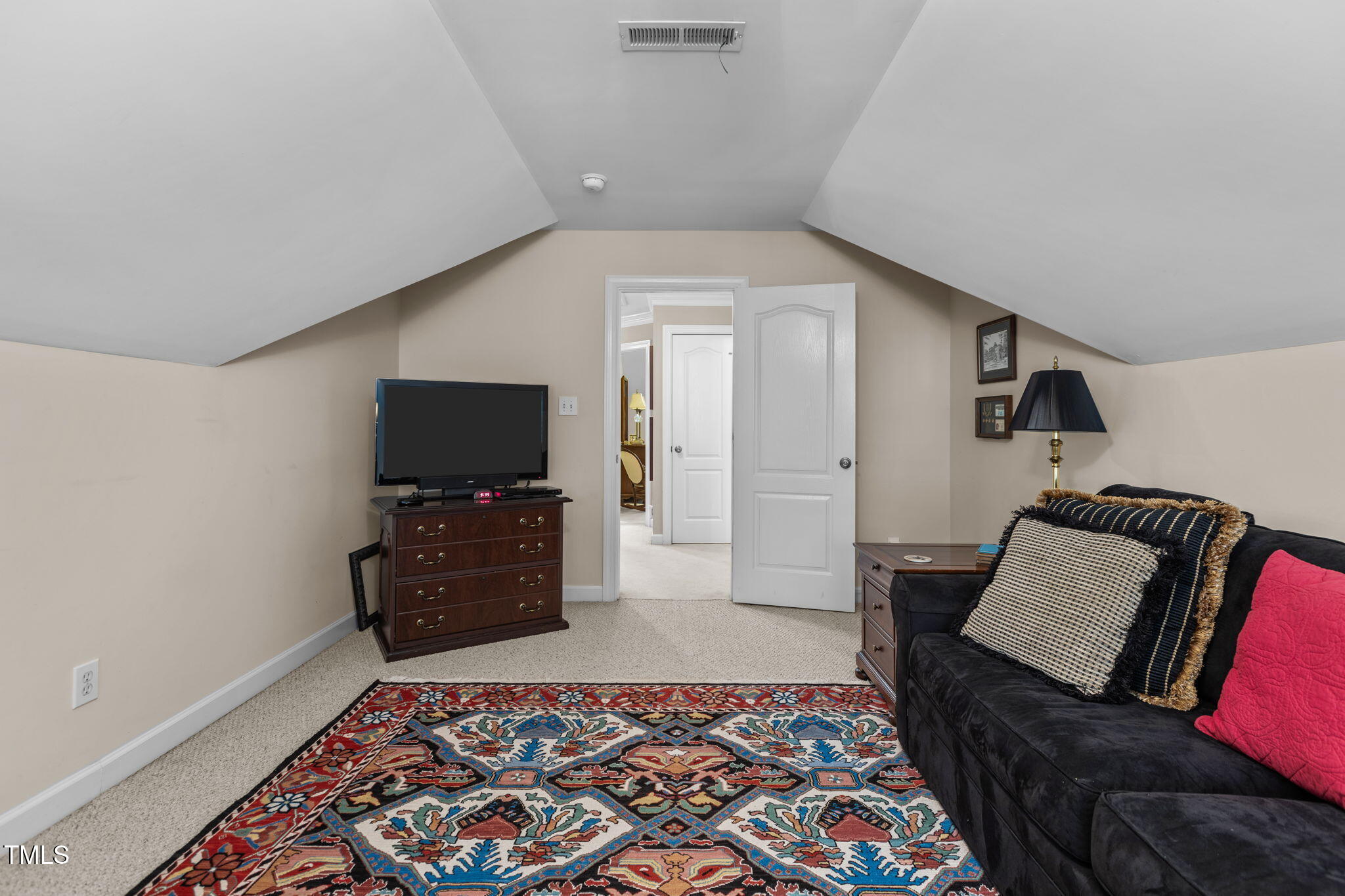 206 Nouveau Avenue Raleigh, NC 27615 - Photo 14 of 61 a living room with furniture and a flat screen tv