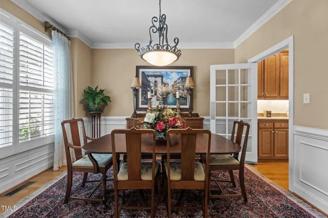 a kitchen with granite countertop stainless steel appliances and refrigerator