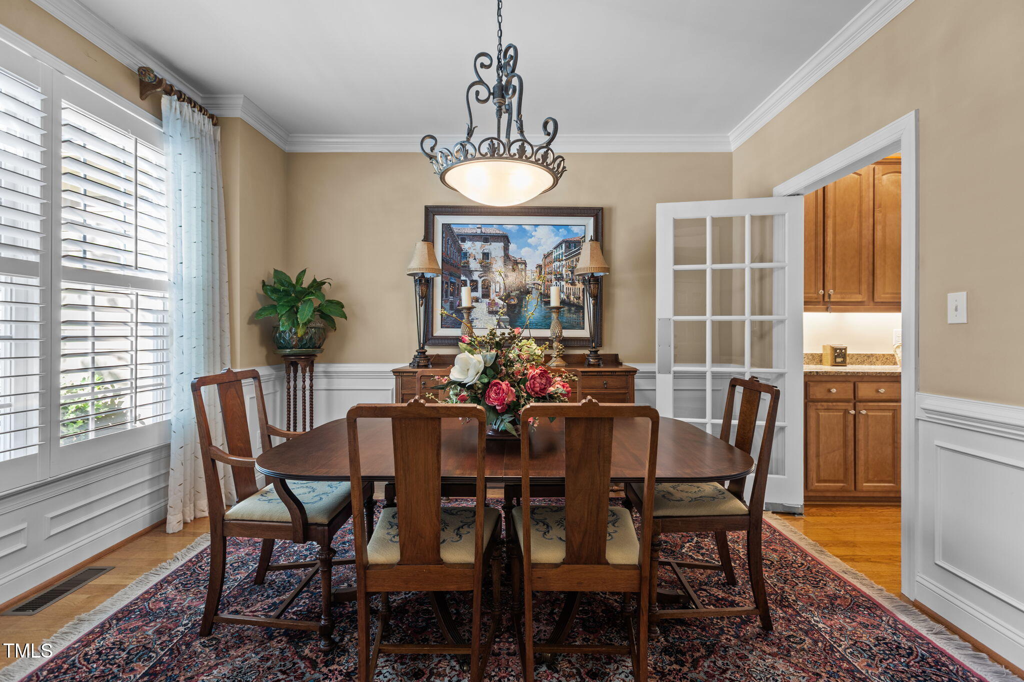 206 Nouveau Avenue Raleigh, NC 27615 - Photo 19 of 61 a view of a dining room with furniture window and outside view