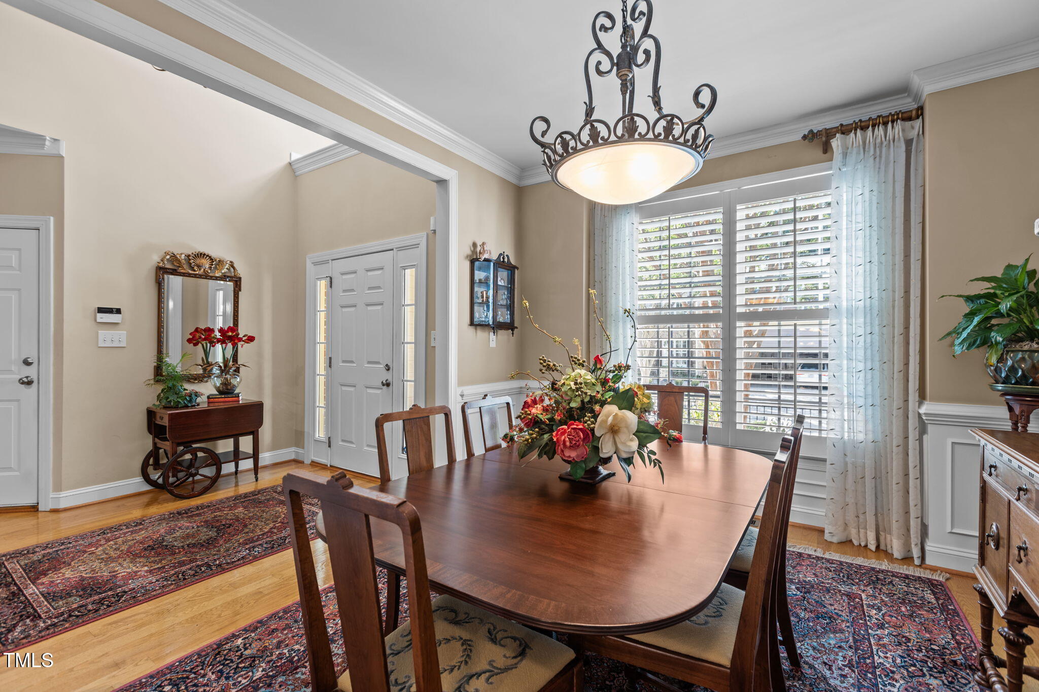 206 Nouveau Avenue Raleigh, NC 27615 - Photo 20 of 61 a view of a dining room with furniture window and wooden floor