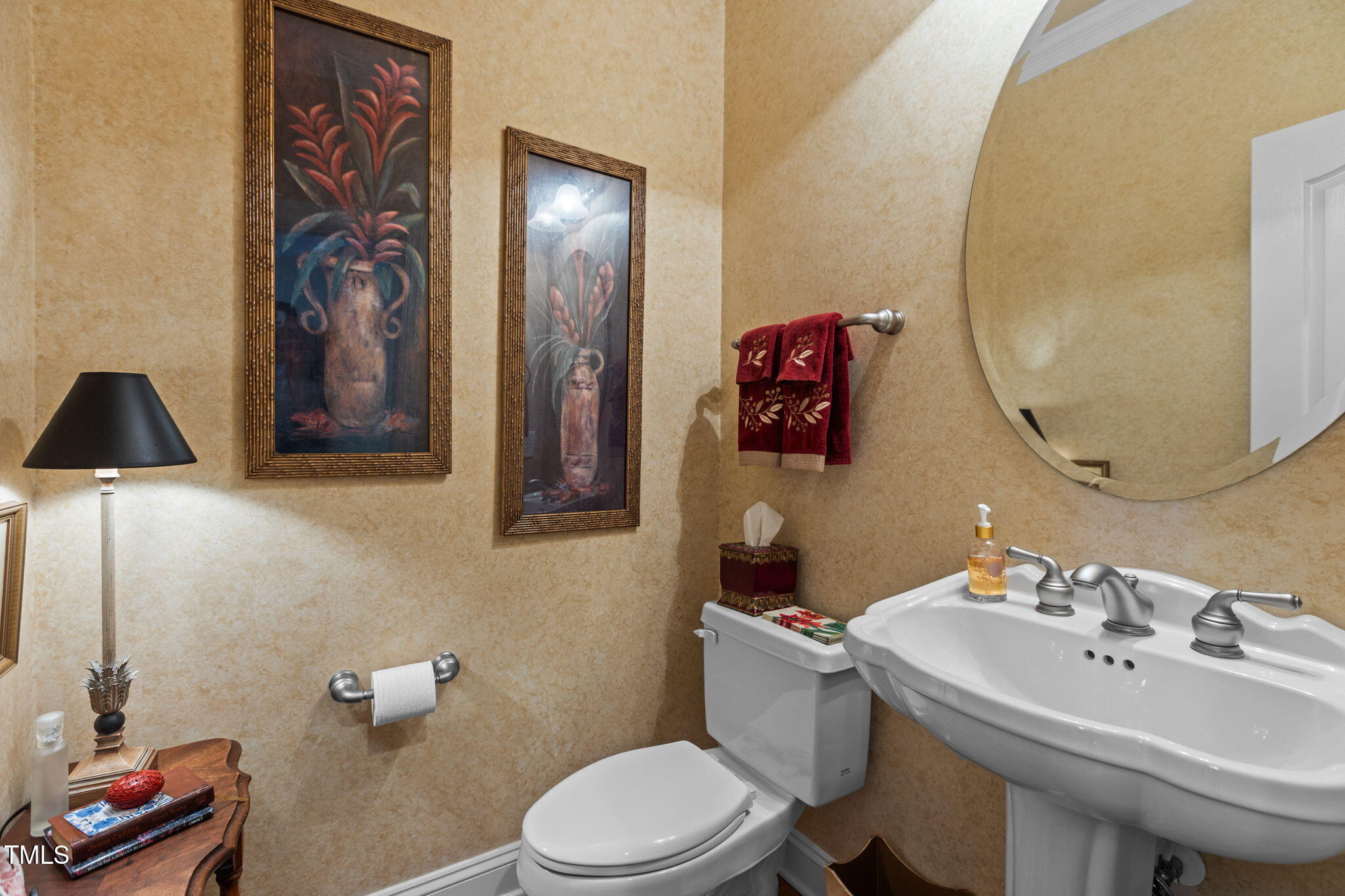 206 Nouveau Avenue Raleigh, NC 27615 - Photo 21 of 61 a bathroom with a sink mirror and toilet
