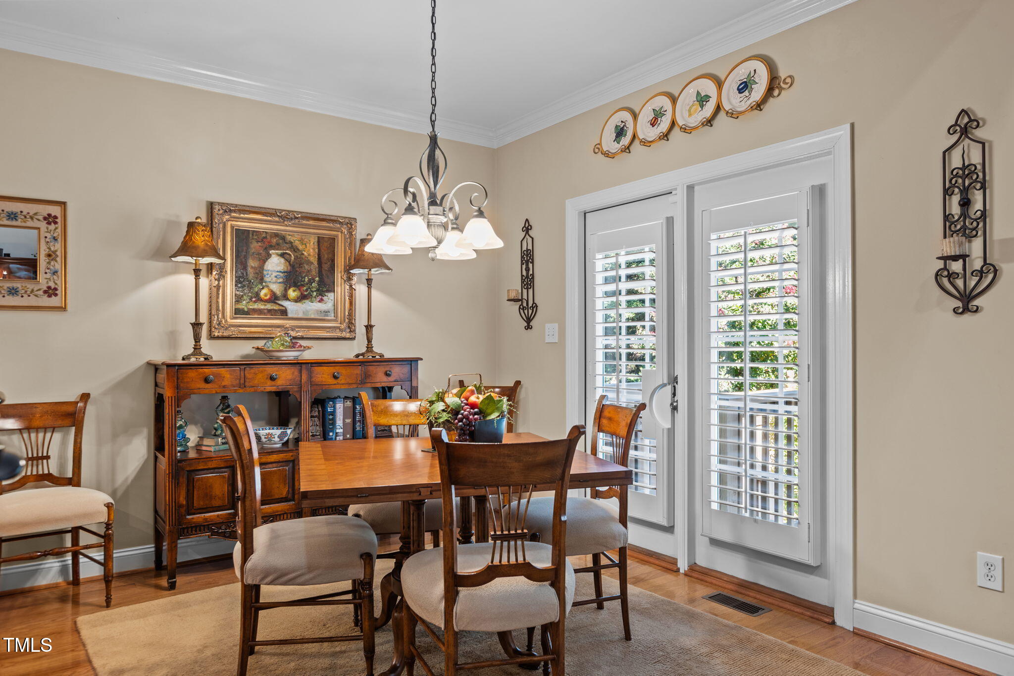 206 Nouveau Avenue Raleigh, NC 27615 - Photo 28 of 61 a view of a dining room with furniture wooden floor and chandelier