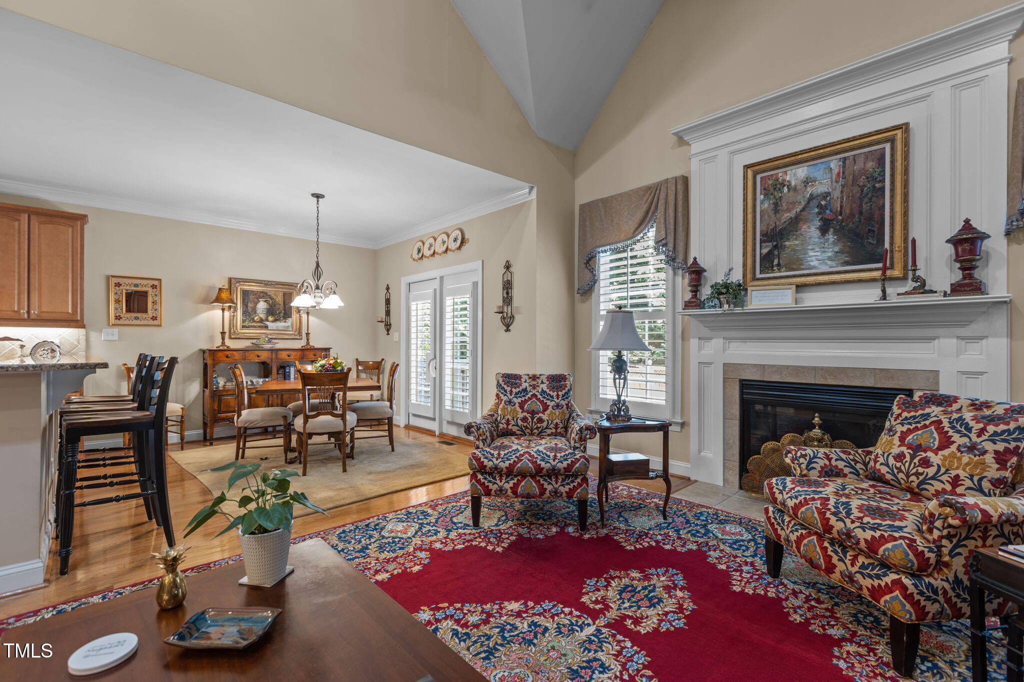 206 Nouveau Avenue Raleigh, NC 27615 - Photo 30 of 61 a living room with furniture a fireplace and a table