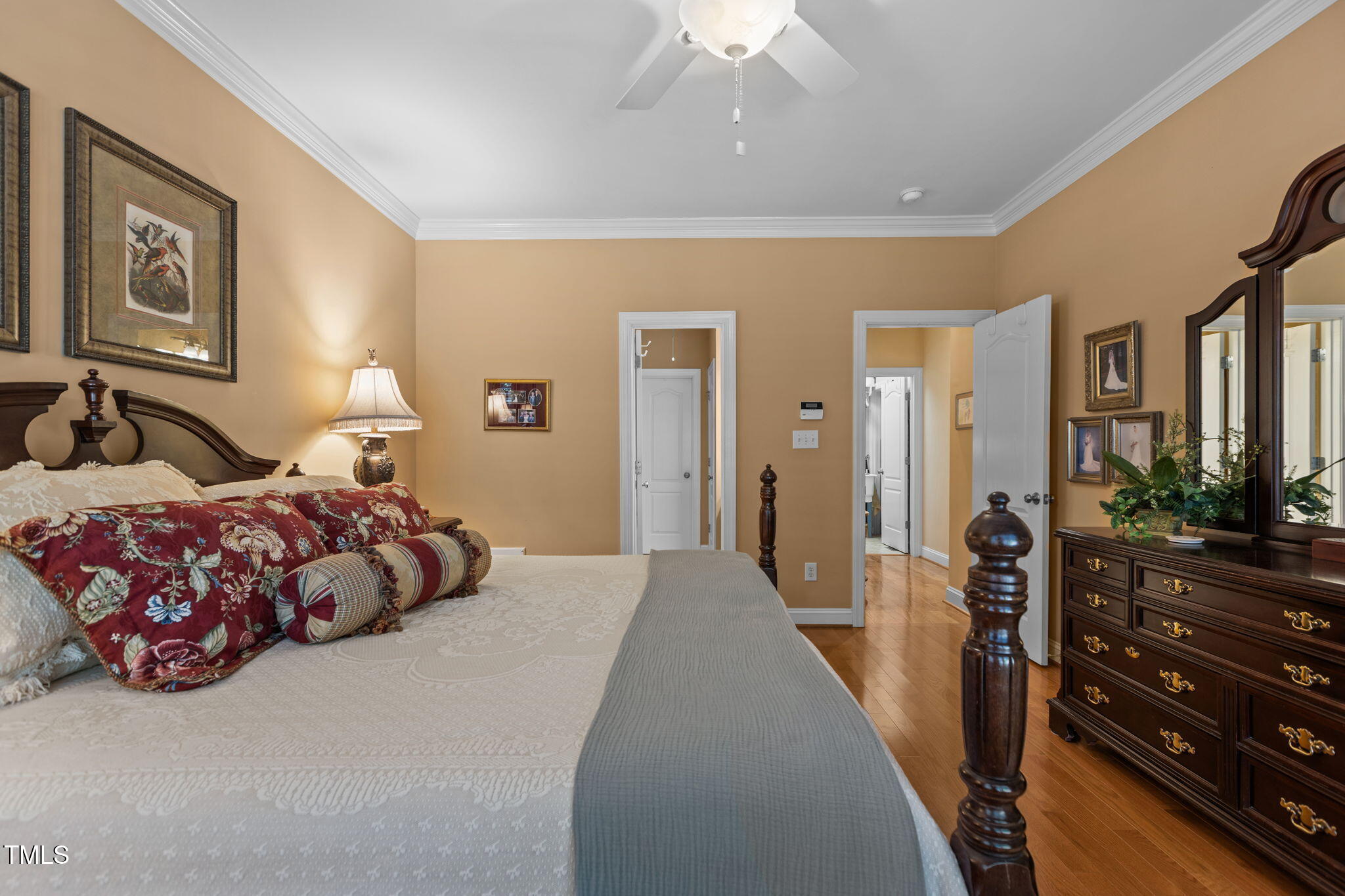 206 Nouveau Avenue Raleigh, NC 27615 - Photo 35 of 61 a bedroom with a bed and a chandelier