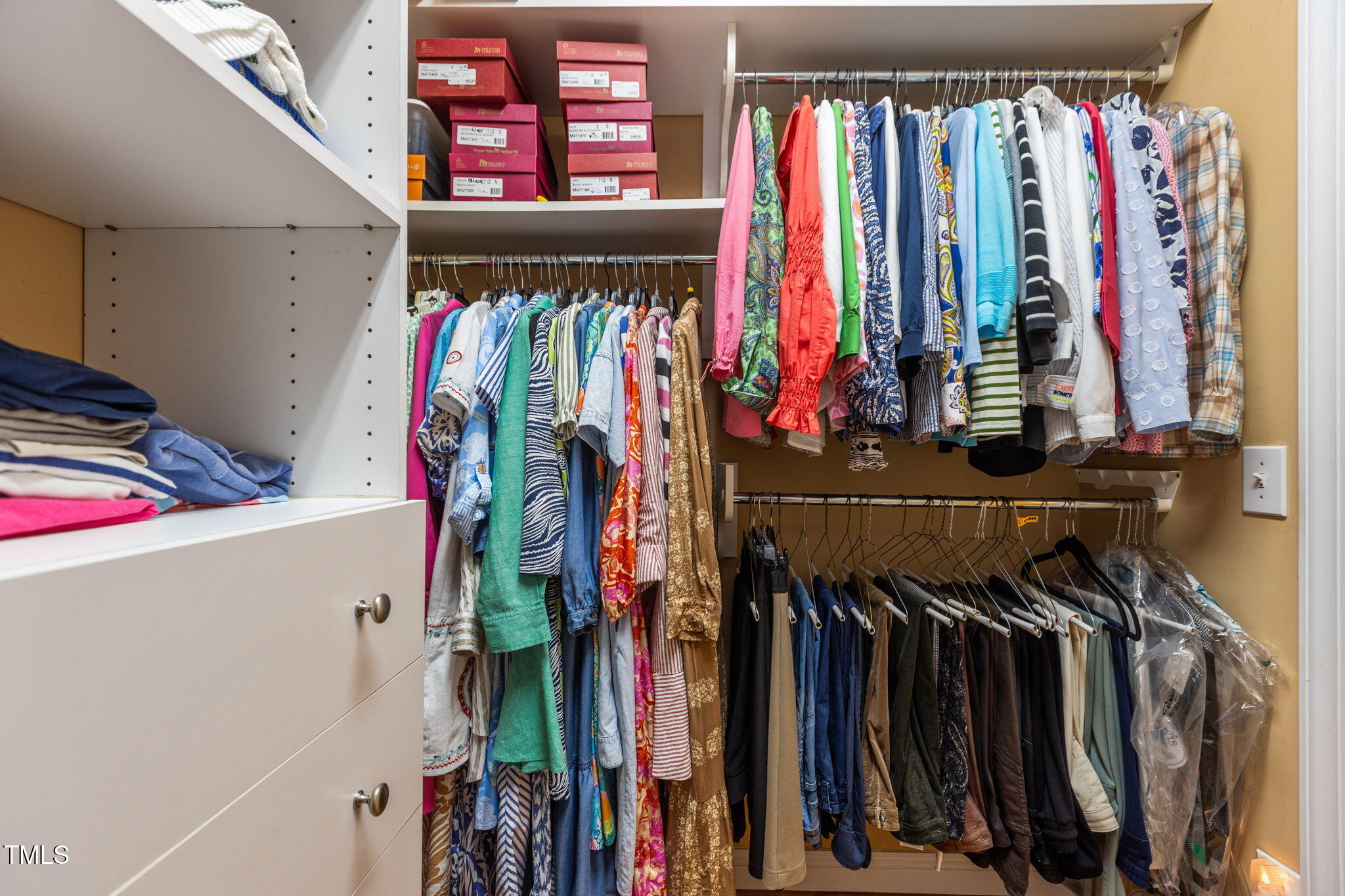 206 Nouveau Avenue Raleigh, NC 27615 - Photo 39 of 61 a view of walk in closet with clothes