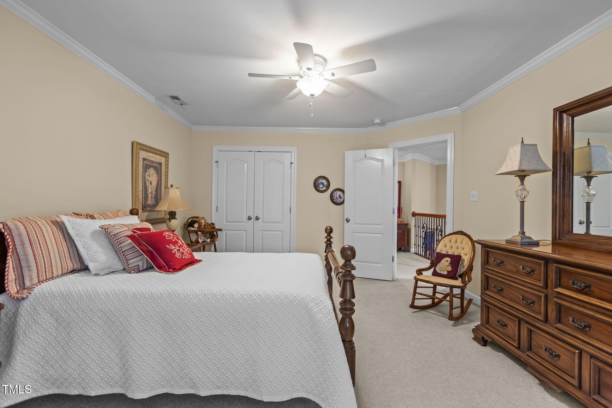 206 Nouveau Avenue Raleigh, NC 27615 - Photo 4 of 61 a bedroom with a bed and a chandelier