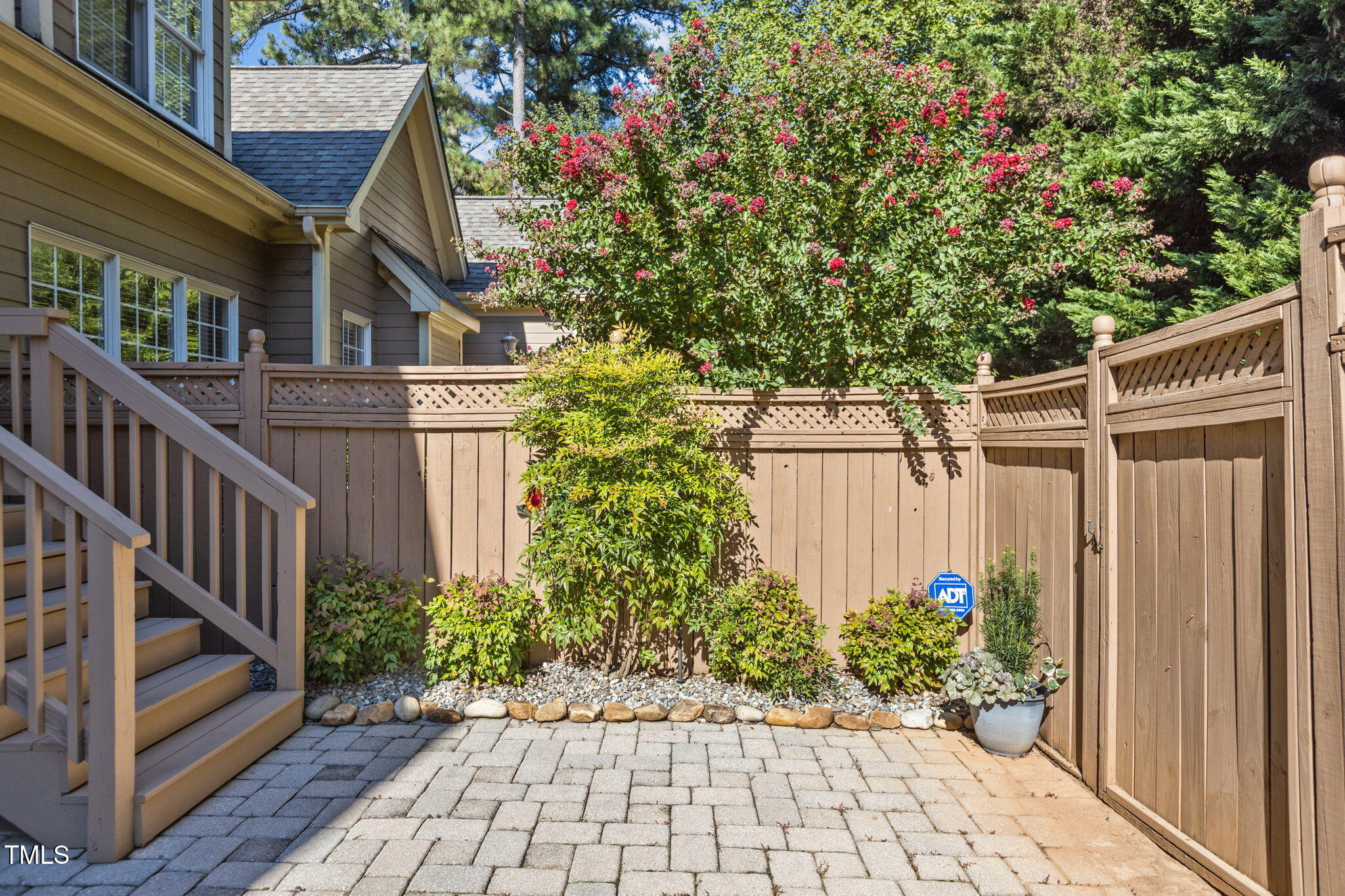 206 Nouveau Avenue Raleigh, NC 27615 - Photo 47 of 61 a view of a pathway of a house with wooden fence