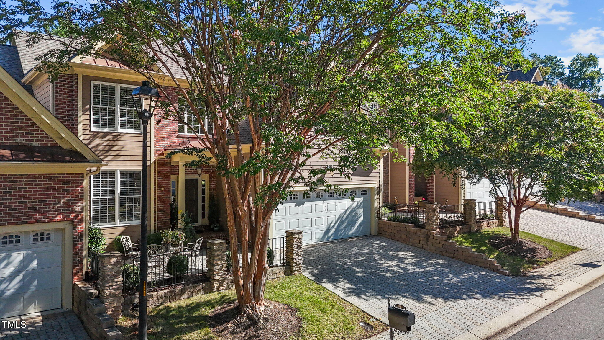 206 Nouveau Avenue Raleigh, NC 27615 - Photo 55 of 61 a view of a patio with table and chairs and potted plants