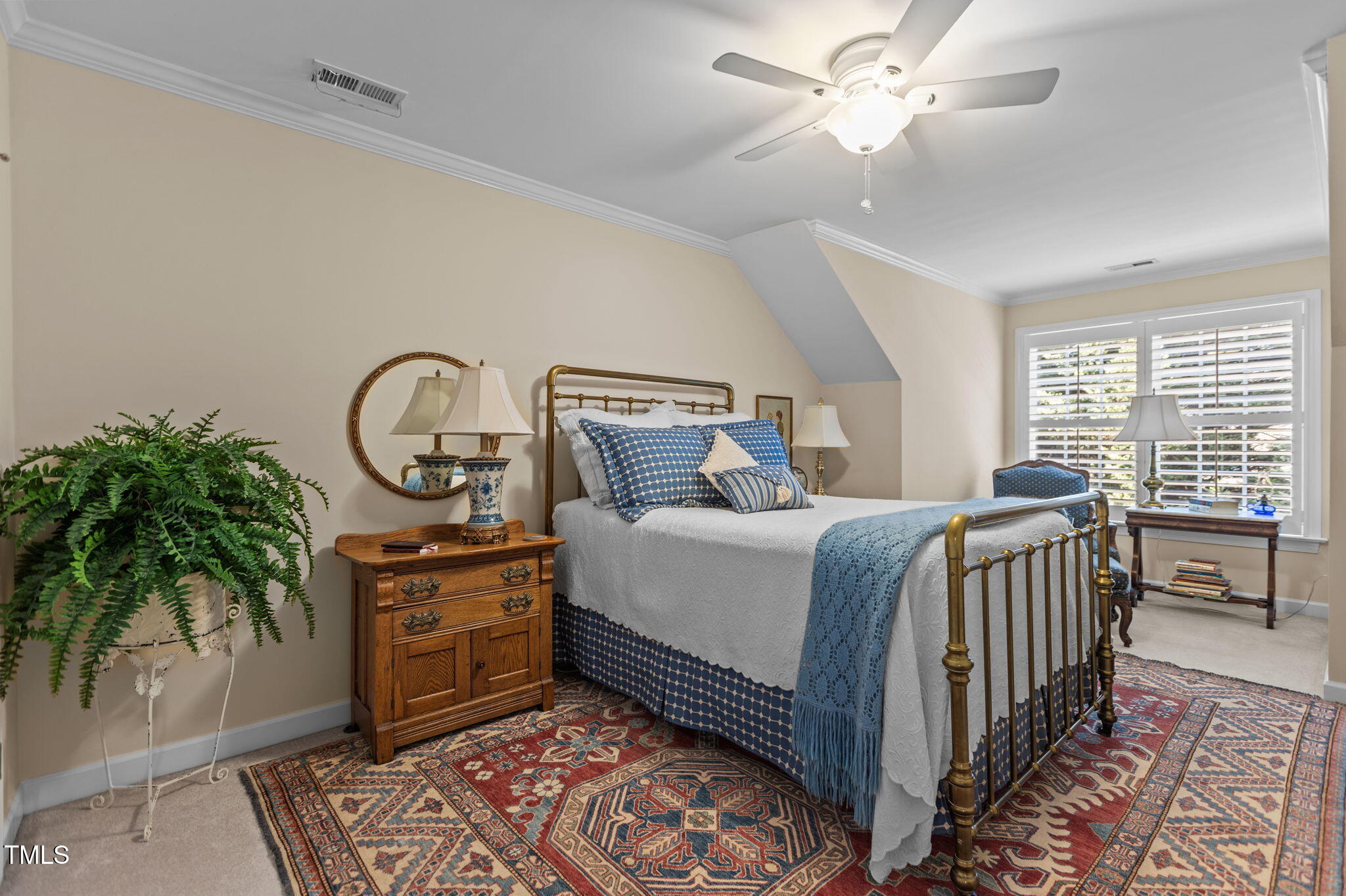 206 Nouveau Avenue Raleigh, NC 27615 - Photo 6 of 61 a bedroom with a bed and a chandelier