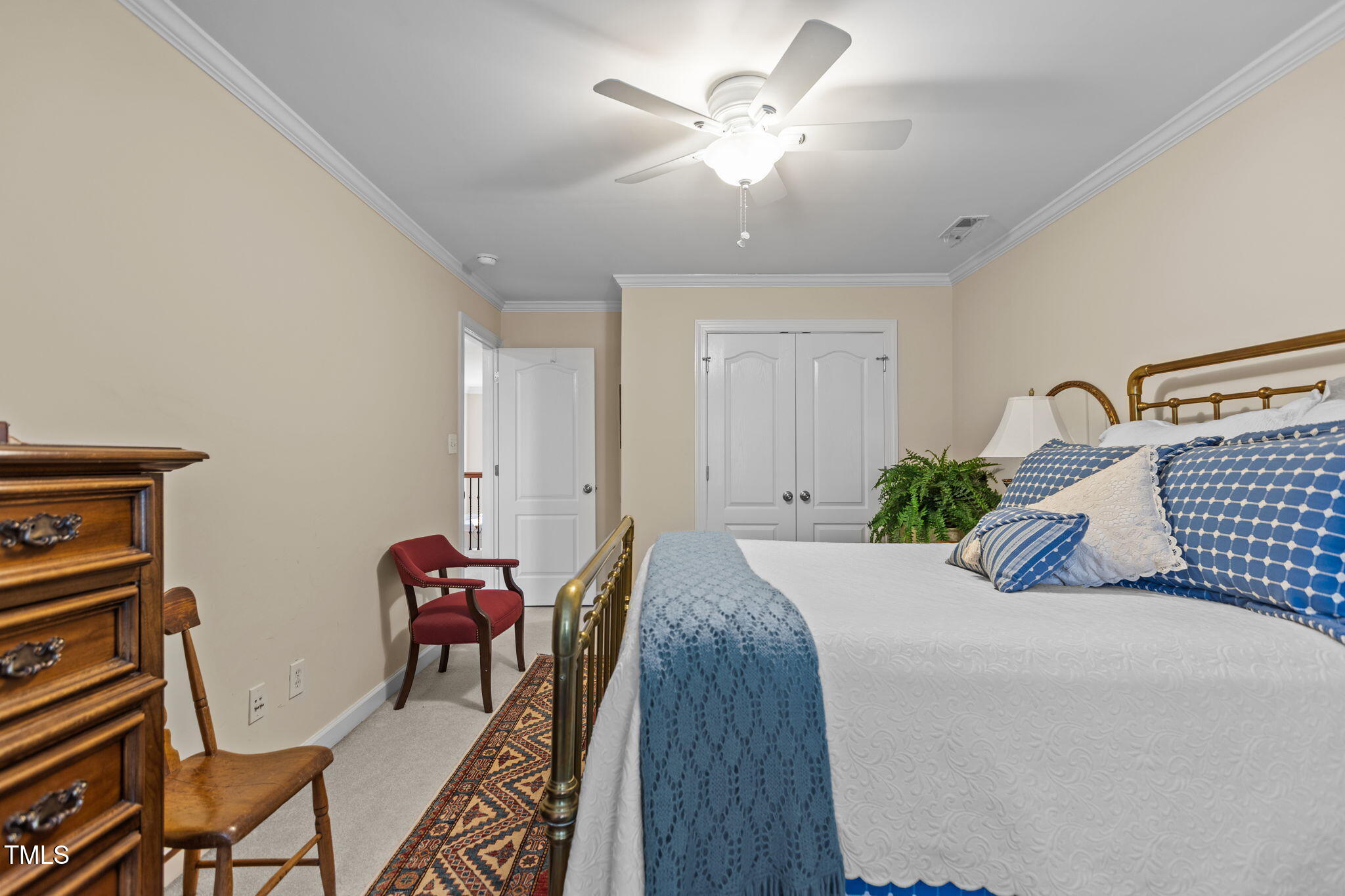 206 Nouveau Avenue Raleigh, NC 27615 - Photo 7 of 61 a bedroom with furniture and a chandelier