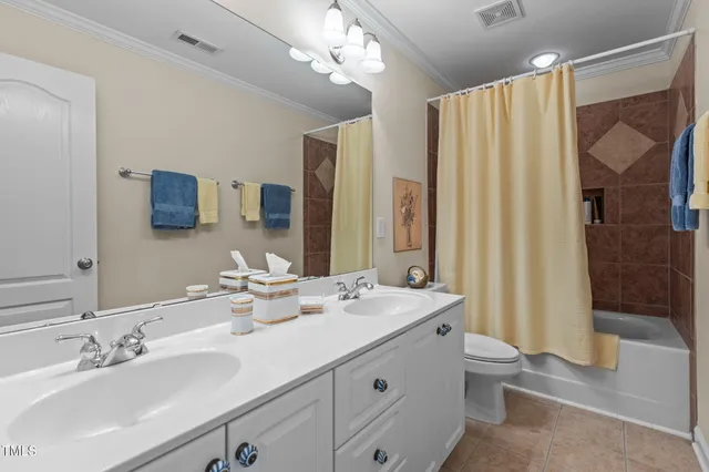 a hallway with furniture and a potted plant