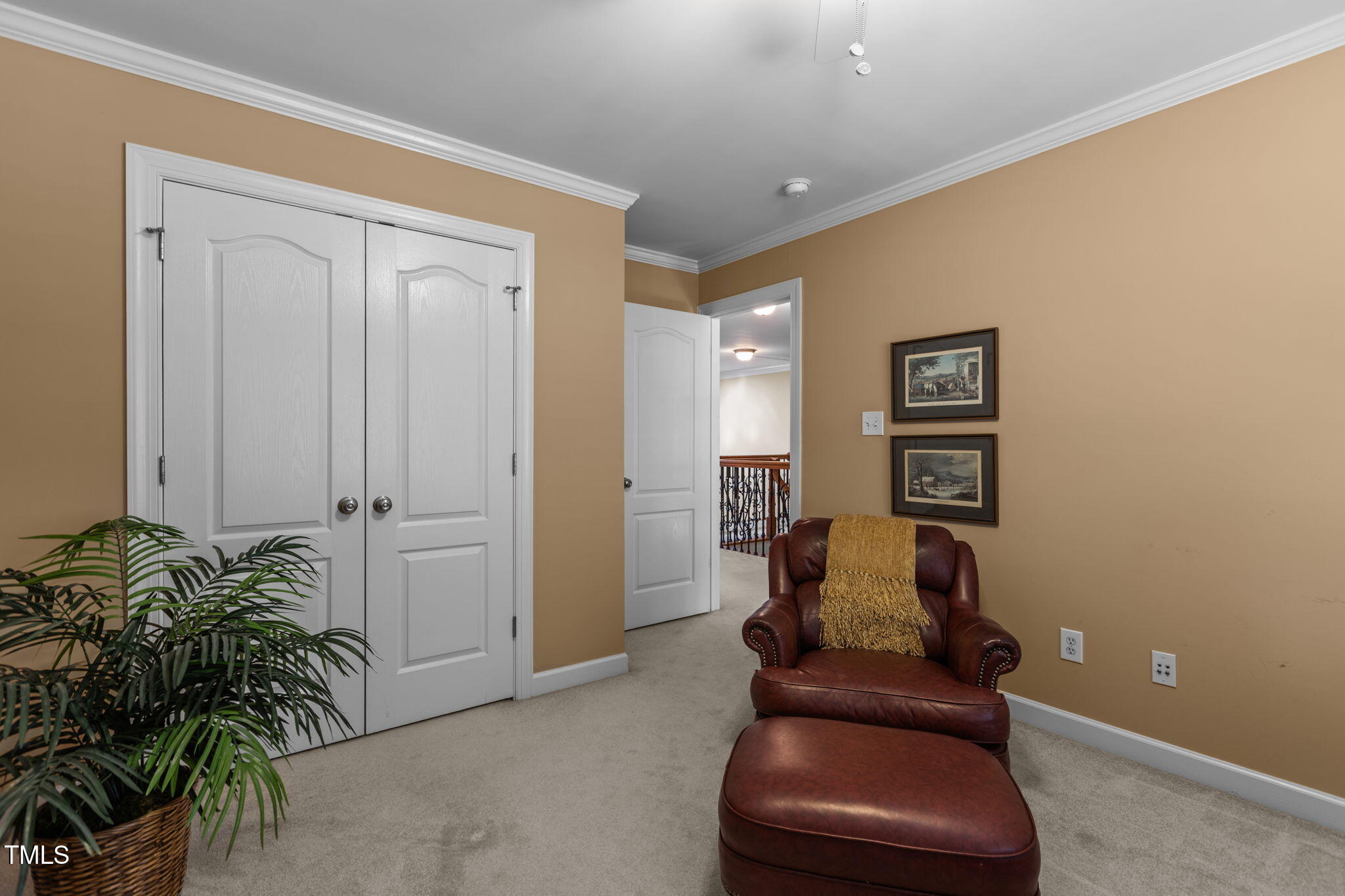 206 Nouveau Avenue Raleigh, NC 27615 - Photo 10 of 61 a hallway with furniture and a potted plant