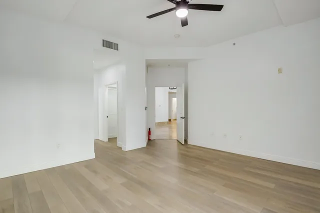 a bathroom with a tub a sink and mirror