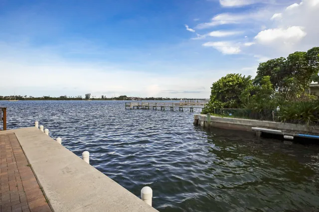 an aerial view of a houses with ocean view
