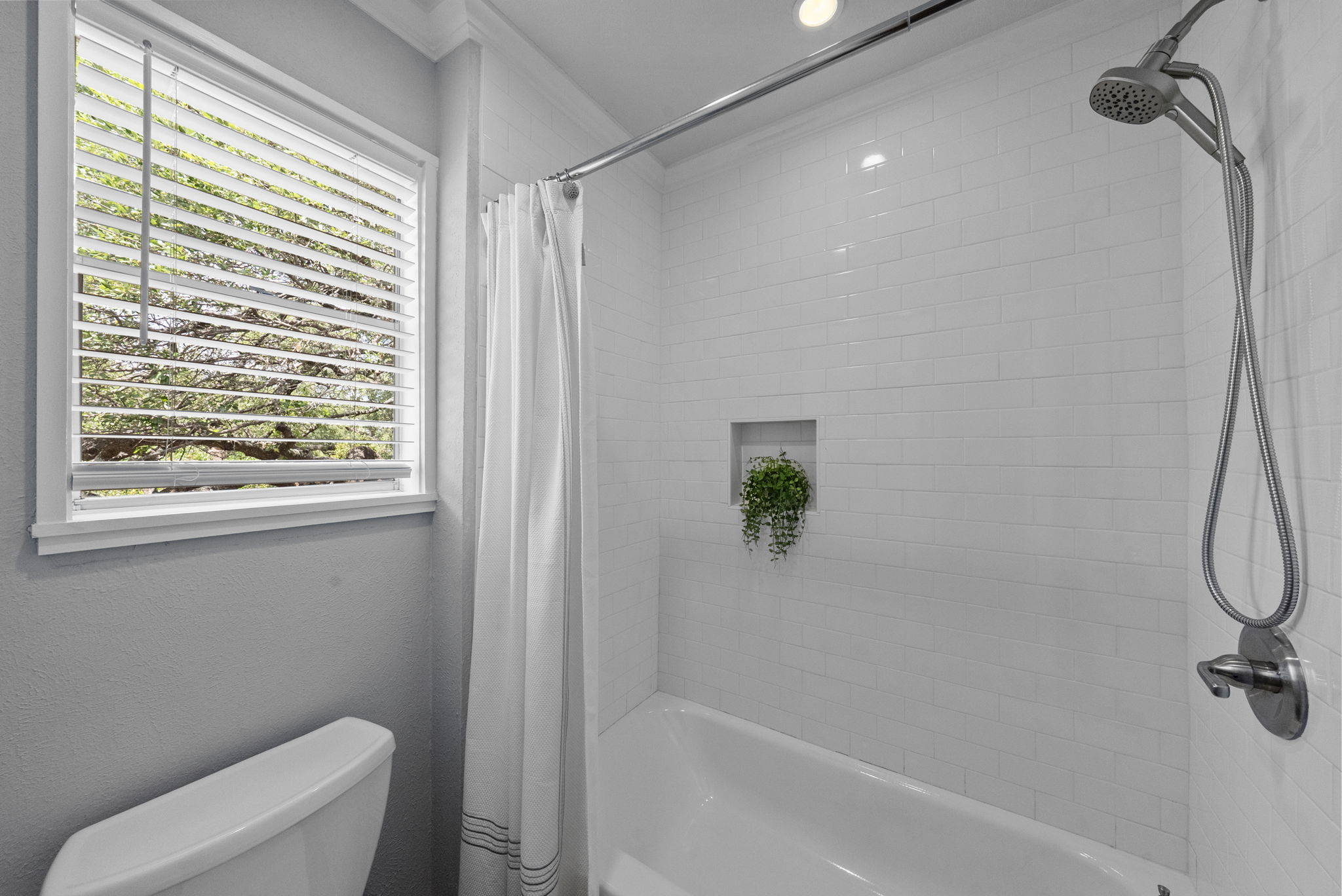 11405 Pyreneese Drive Austin, TX 78759 - Photo 16 of 37 a bathroom with a shower and a bathtub