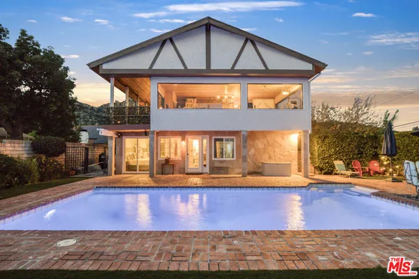 a view of a swimming pool with a patio
